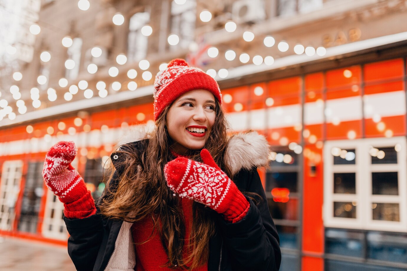 young_pretty_smiling_excited_happy_woman_in_red_mittens_and_knitted.jpg