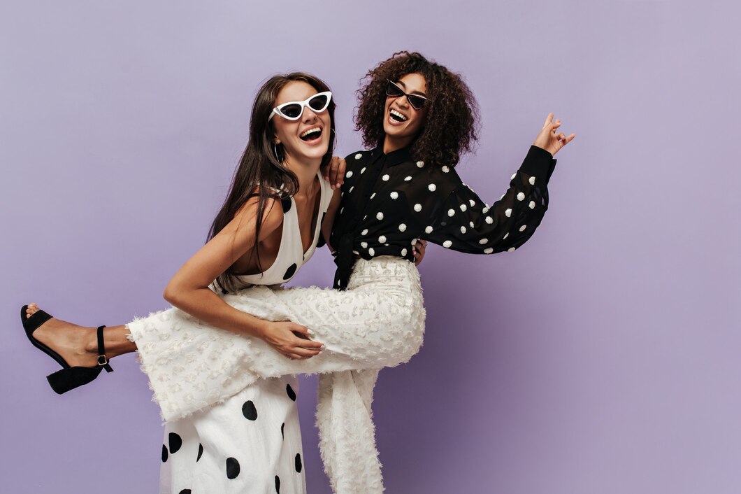 wonderful-woman-black-blouse-trendy-white-pants-laughing-having-fun-with-her-friend-sunglasses-isolated-wall_197531-24365.jpg