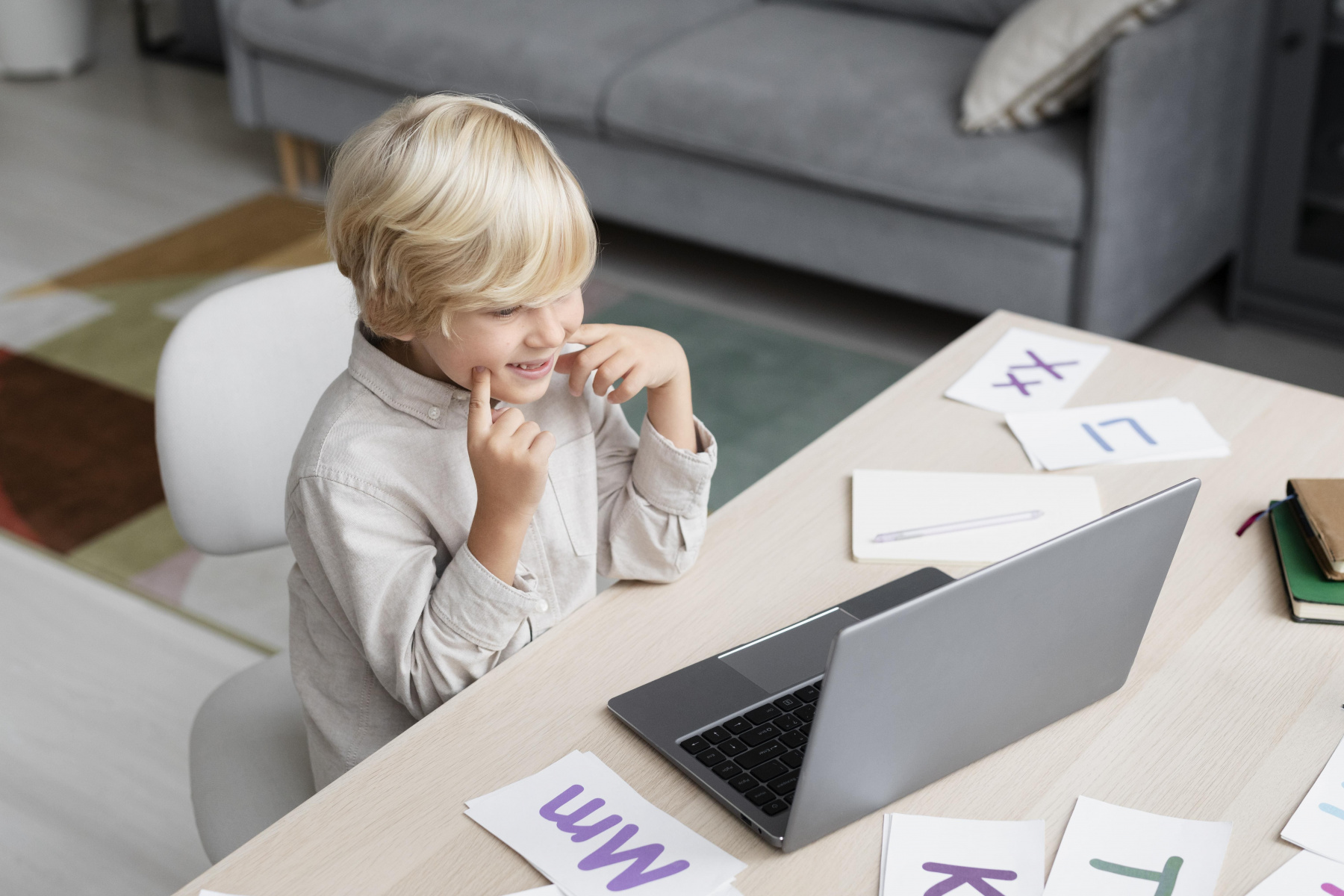 adorable-little-boy-doing-online-session-speech-therapy.jpg