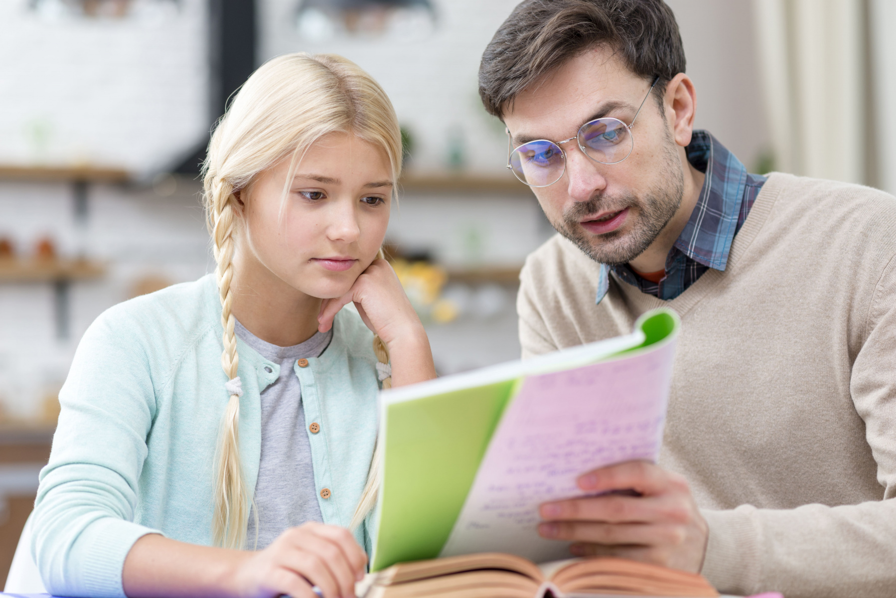 tutor-girl-home-reading-from-notebook.jpg