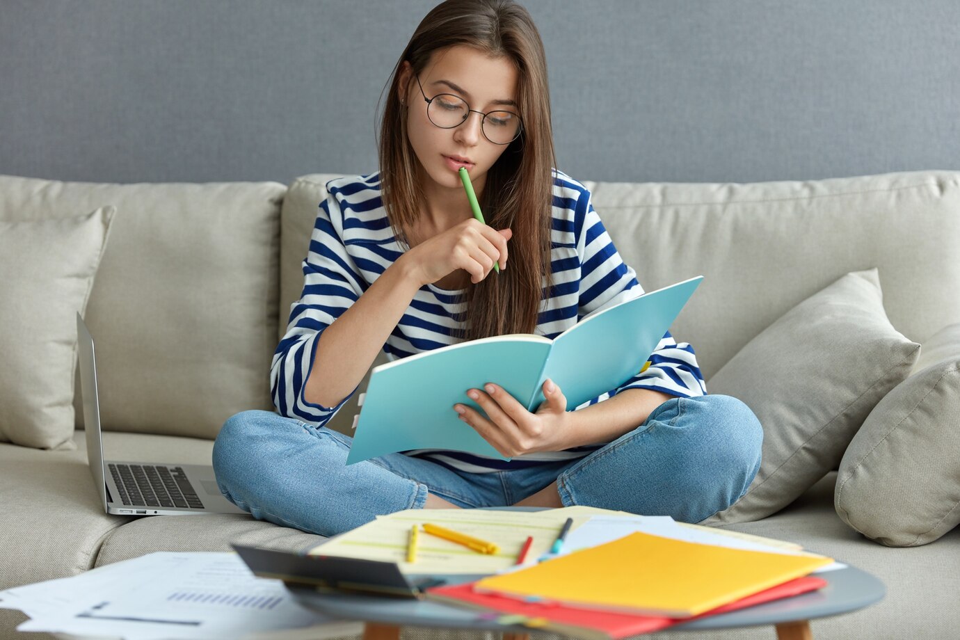 studying_online_concept_serious_young_woman_being_busy_with_remote.jpg