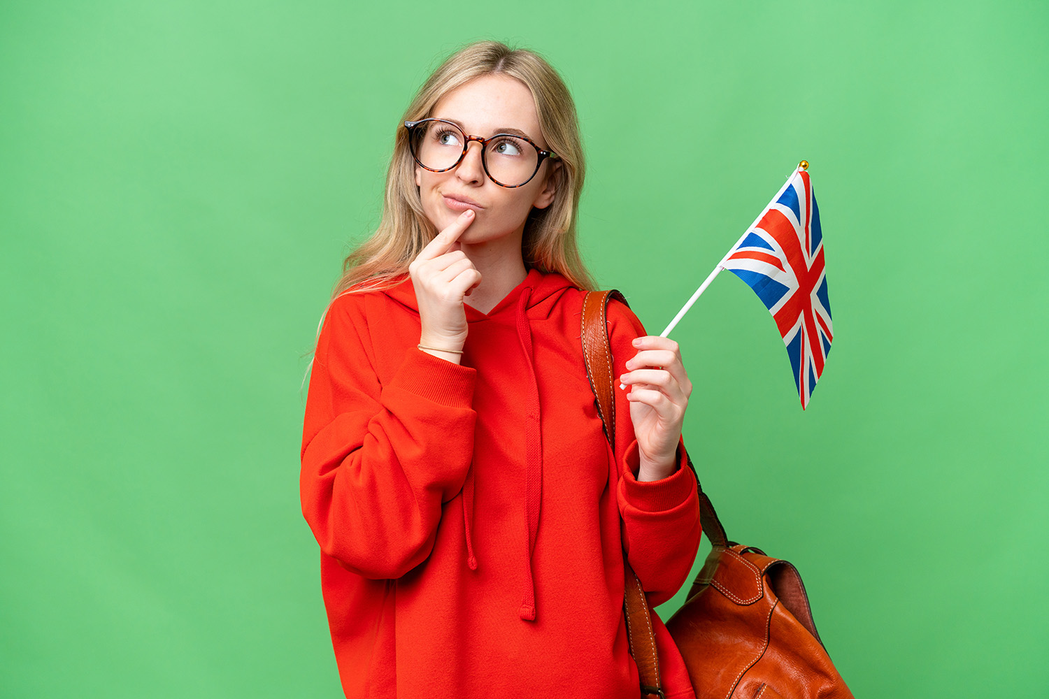 young_hispanic_woman_holding_united_kingdom_flag_isolated_background (2).jpg