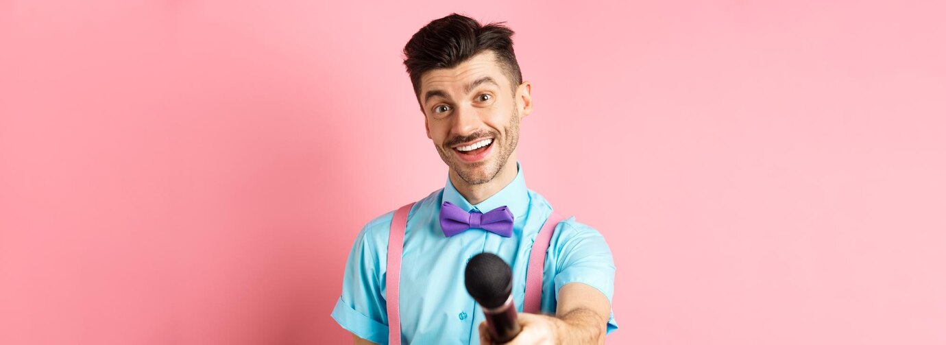 smiling-guy-with-moustache-bowtie-asking-comments-interview-stretch-out-hand-with-microph_1258-172377.jpg